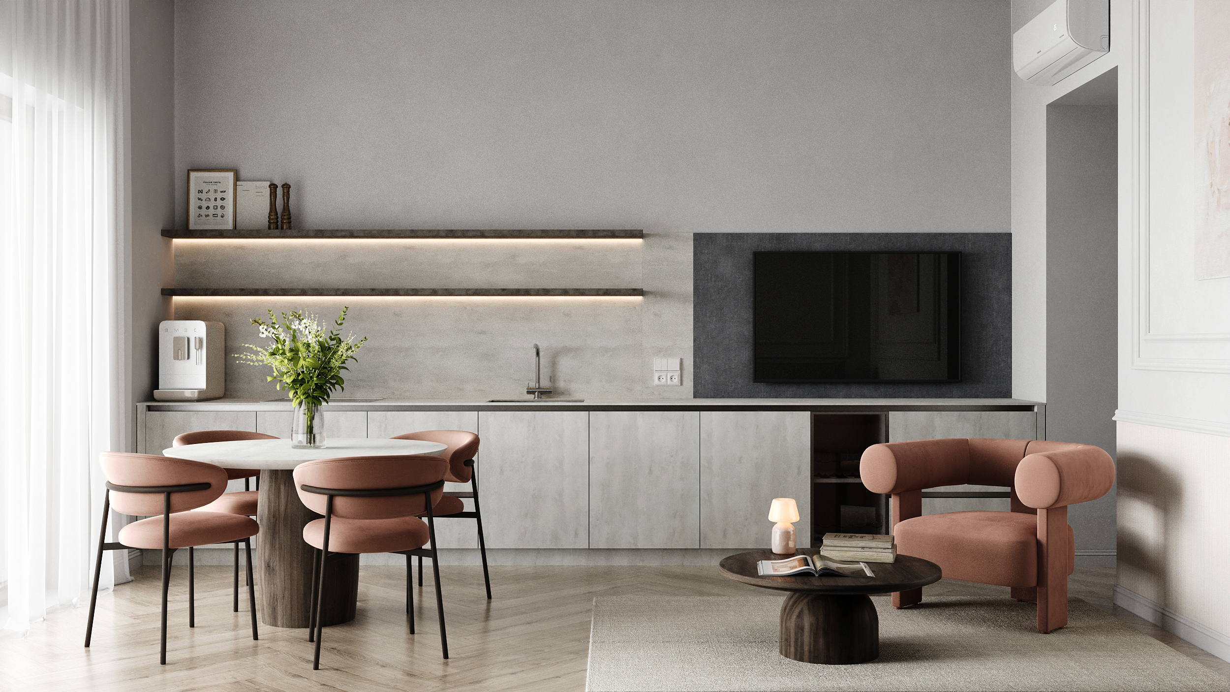 Offene Küchenzeile mit rundem Esstisch, Lounge-Sessel und Fernseher